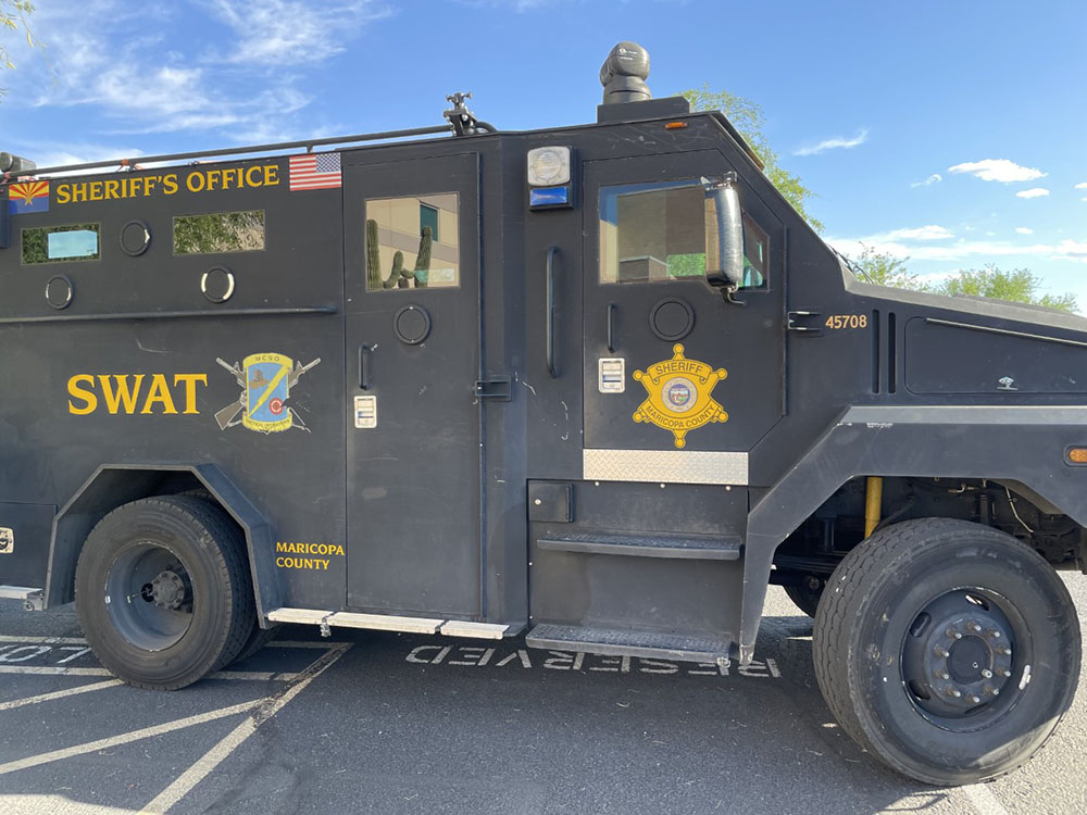 An MCSO SWAT armored vehicle parked outside the SWAT barn