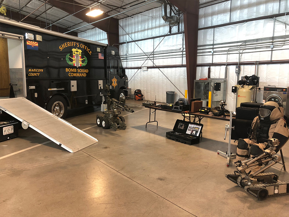 Bomb squad vehicle and EOD equipment on display inside the MCSO SWAT barn