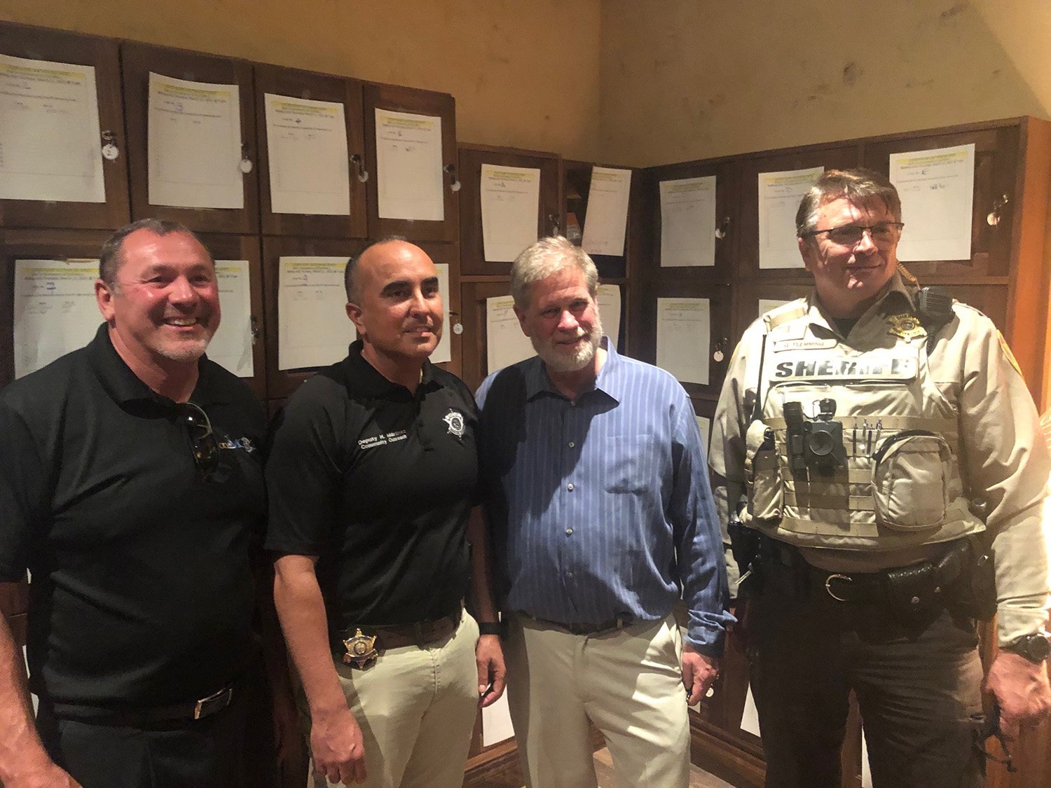 Council members with an MCSO deputy at the Carefree fundraiser